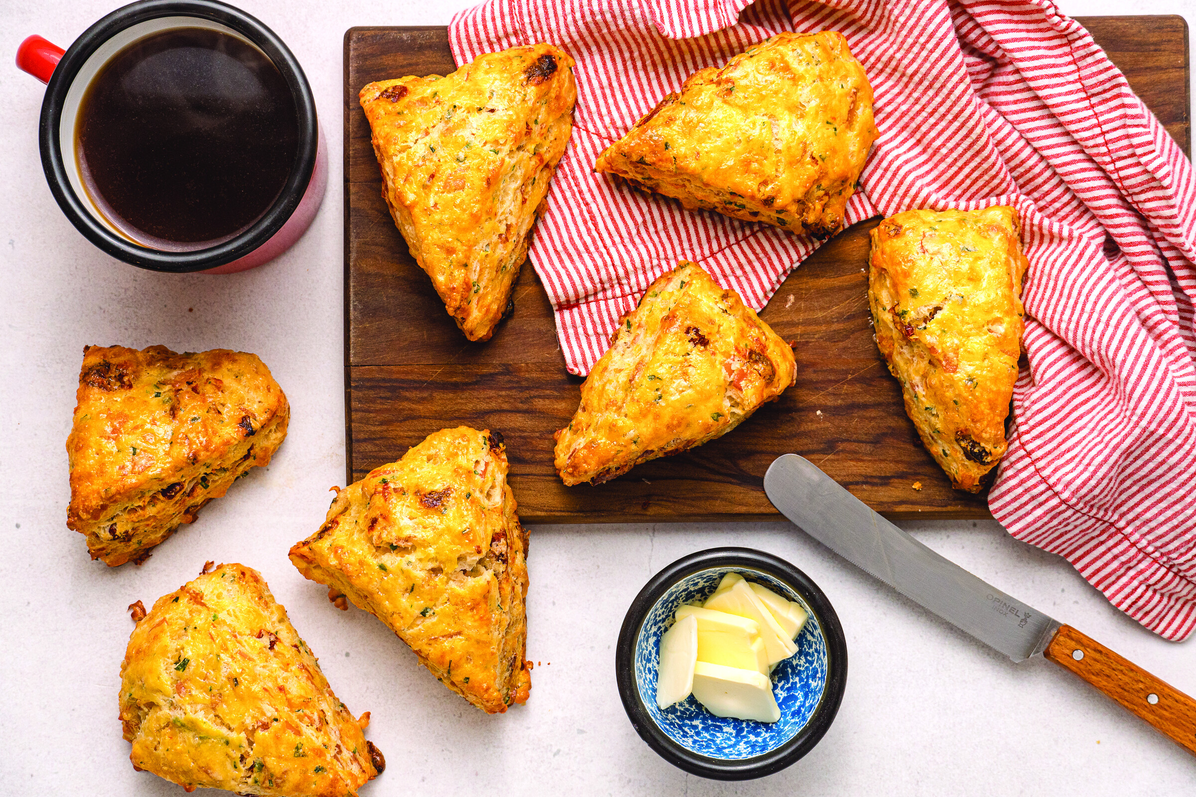 Savory Breakfast Scones with butter and coffee