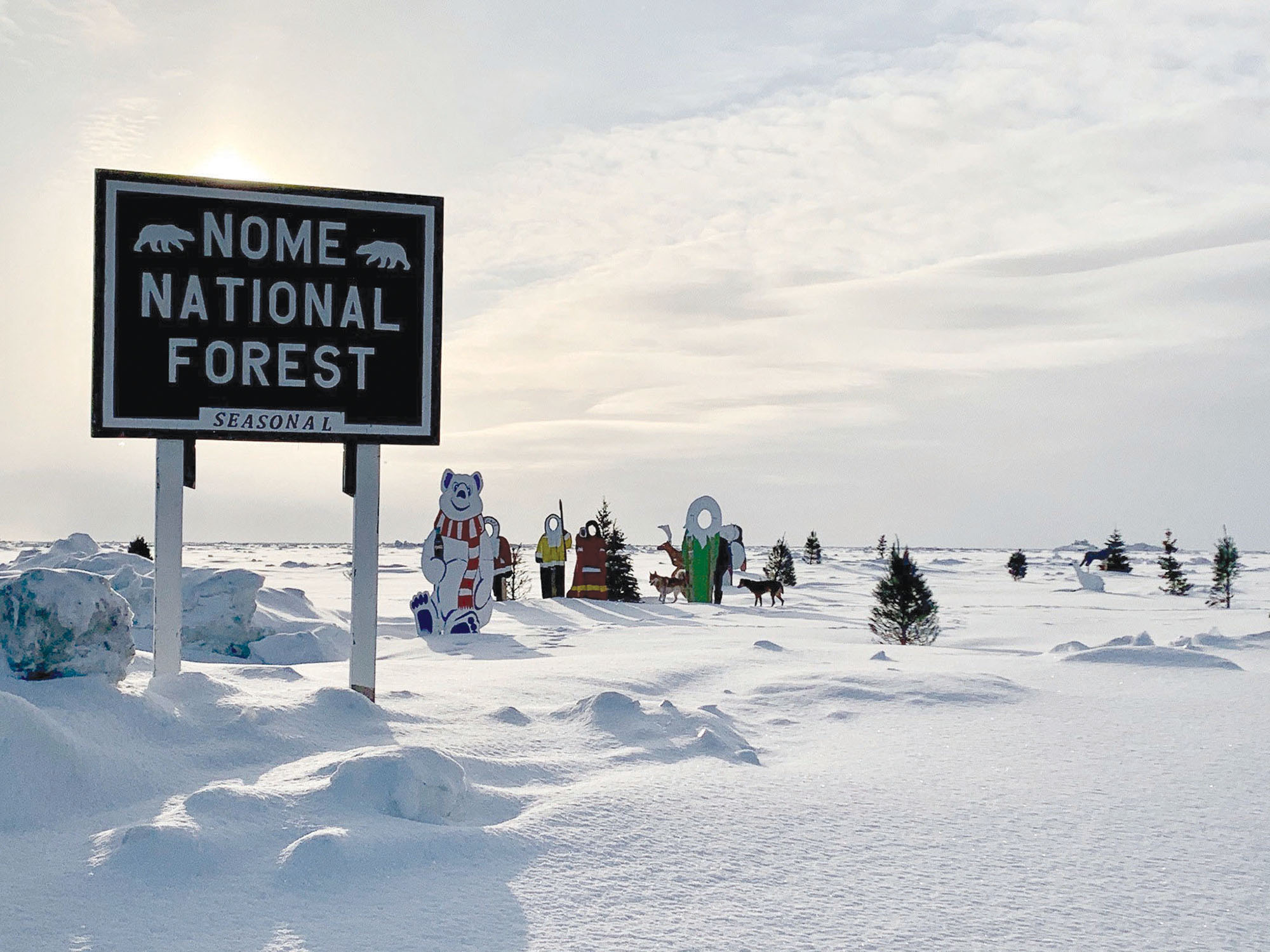 Nome National Forest sign on frozen Bering Sea